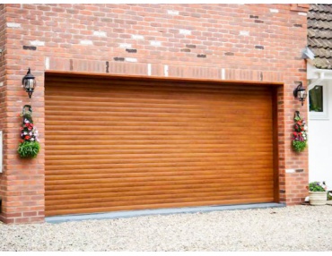 Wide Roller Shutter Garage Door in Tan Wood Finish.